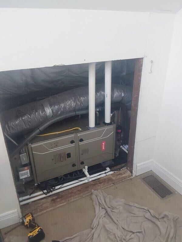 Completed full HVAC system replacement at commercial property including removal and EPA-compliant disposal of existing equipment. Installed new Bryant 3.5-ton split system consisting of GA4SAN542 condensing unit, CVAVA42 evaporator coil, and 912SB42080 80,000 BTU 90% efficiency gas furnace. Relocated furnace from previous location back to attic cubby hole for improved accessibility and space optimization. Ran new refrigerant lineset between outdoor condensing unit and indoor coil, installed new condensate drain pan with proper drainage, and fabricated sheet metal transitions to connect furnace to existing flue system. Mounted condensing unit on new equipment pad with proper gravel base for drainage and stability. Installed electrical disconnect, whip, and fuses for outdoor unit per code requirements. Verified all electrical connections, tested system operation including heating and cooling cycles, and confirmed proper airflow and refrigerant charge. Obtained necessary permit and comple