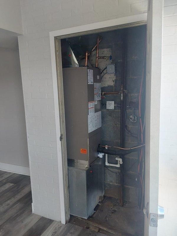 Completed full commercial HVAC system installation including BCRMA2124S3N3 water fan coil unit installed in interior utility closet and NCP5243000A through-wall AC unit with rooftop condenser. Connected new equipment to existing supply lines using copper piping and fittings, installed new thermostat for system control, and obtained necessary permits for the installation.