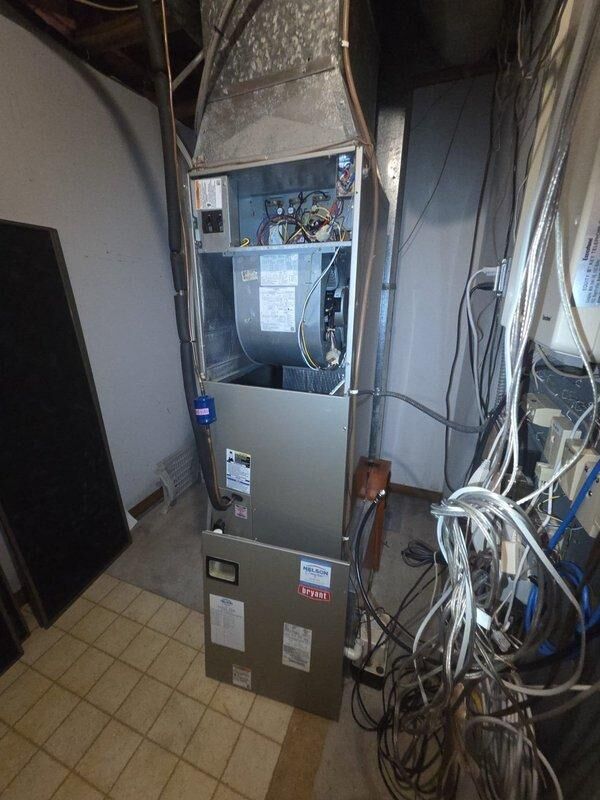 Performed inspection of existing heat pump system and confirmed compressor failure with short to ground as reported by lead. System consists of Bryant outdoor condenser unit with paired indoor air handler in utility room. Recommended complete heat pump system replacement due to electrical fault in compressor and age of equipment.