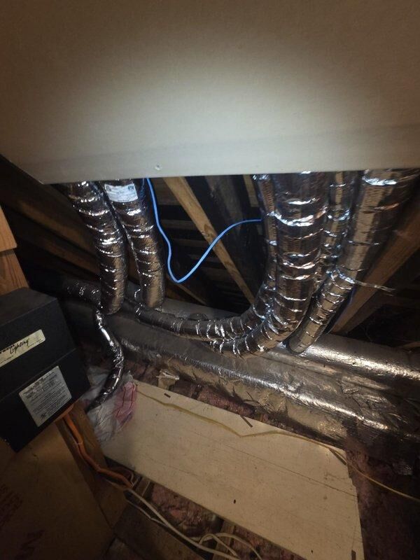 Conducted assessment for second-floor HVAC system replacement, confirming presence of existing Unico high-velocity system in attic space with flexible insulated ductwork. Customer is interested in heat pump conversion option; documented current installation including Honeywell controls, PVC connections, and overall system configuration to prepare comprehensive replacement proposal.