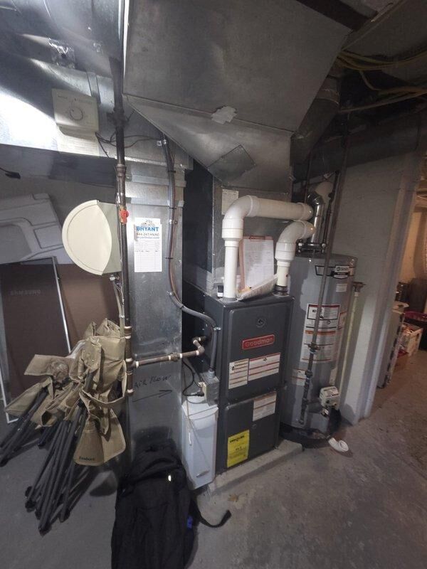 Conducted a replacement estimate for a Goodman furnace system with connected Bryant components. Evaluated existing ductwork configuration and Honeywell humidifier installation. Documented current mechanical room setup including water heater integration and PVC exhaust ventilation to provide comprehensive replacement options.