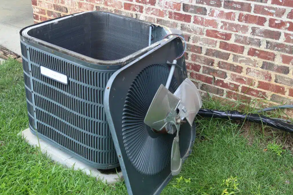 AC condenser unit with fan removed and put to the side