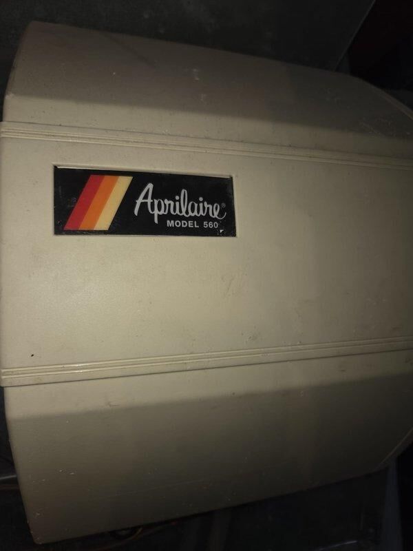 Lebanon, OH - Responded to service call regarding water around ground floor. Inspected Aprilaire Model 560 humidifier showing signs of age and discoloration. Identified unit as source of water leak, performed necessary repairs to resolve the issue.