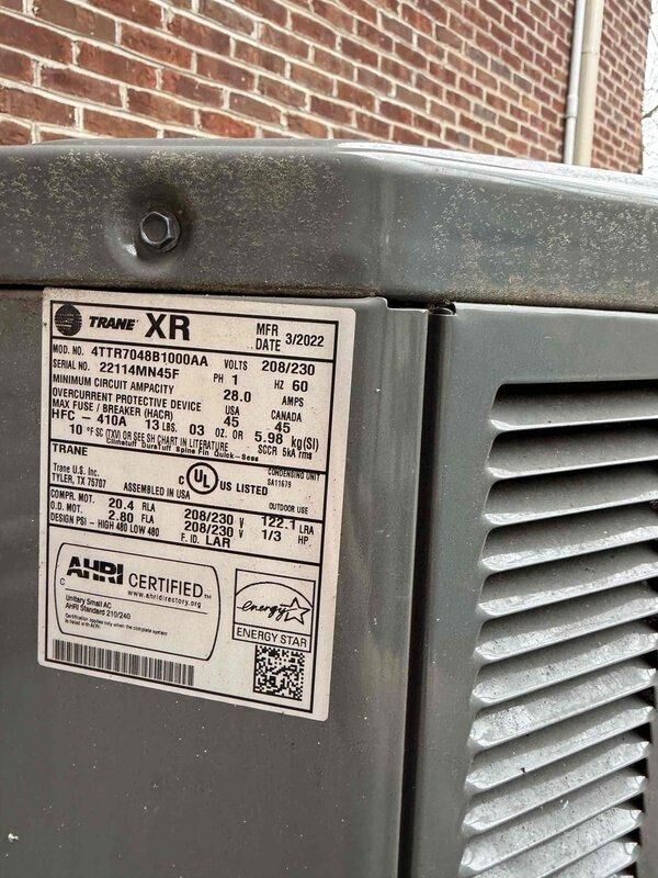 Cincinnati, OH - Responded to thermostat issue reported by homeowner. Upon arrival, verified system operation and confirmed both heating and cooling functions working properly. Documented equipment information for Trane XR heat pump unit (Model: 4TTR7048B1000AA, Serial: Z114MN45F, manufactured March 2022) and assessed thermostat functionality, noting age of thermostat unknown but system responding to temperature calls correctly.