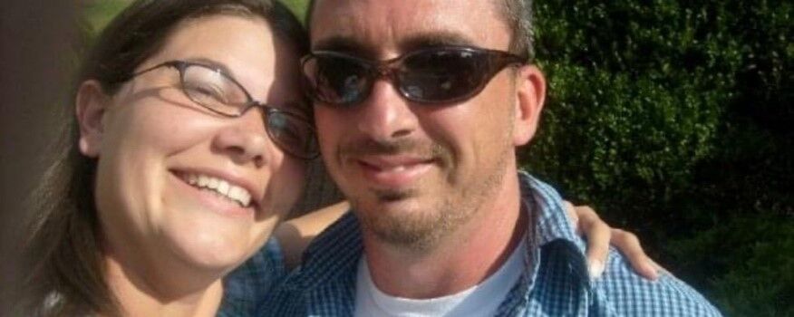 Rob and his wife smiling for a close up picture